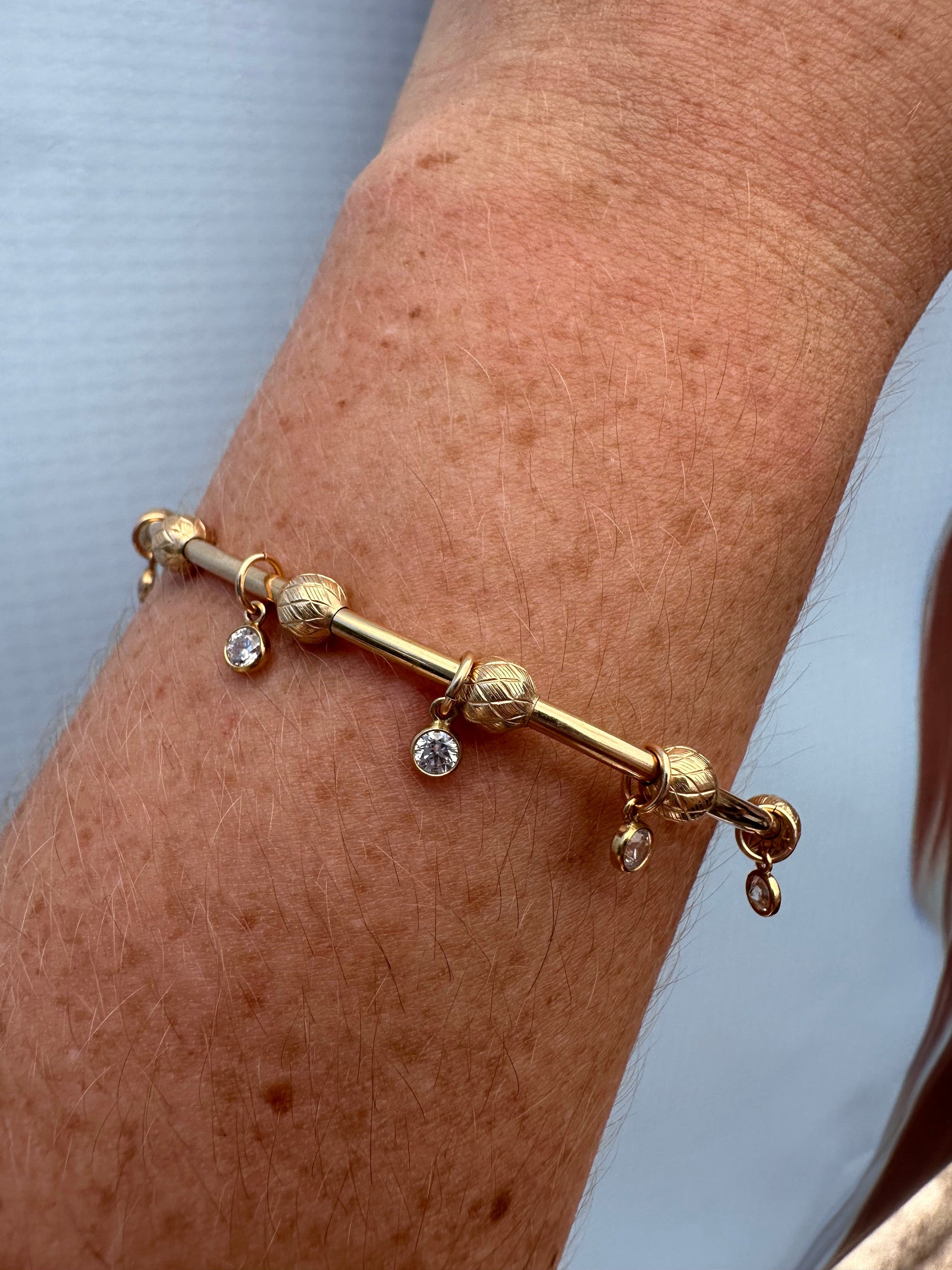 DRIP JEWELRY BRACELETS Criss Cross Bead on Gold Cuff with 5 tiny sparkles / Thin Gold Cuff Slider Bead Cuffs with Sparkles (14k gold-filled)
